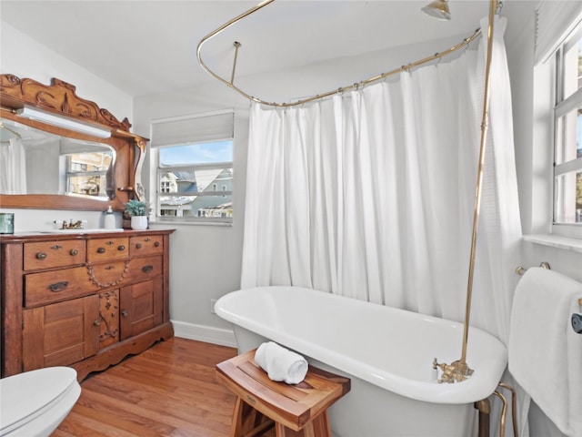 bathroom with hardwood / wood-style flooring