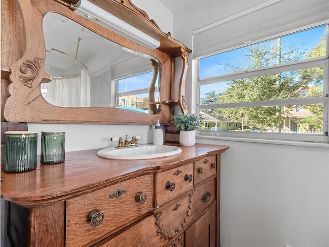 bathroom featuring vanity and walk in shower