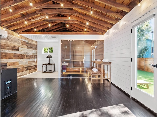 interior space with vaulted ceiling with beams, wooden ceiling, and a wall mounted air conditioner