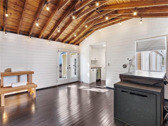 miscellaneous room featuring beam ceiling, dark wood-type flooring, and wood ceiling