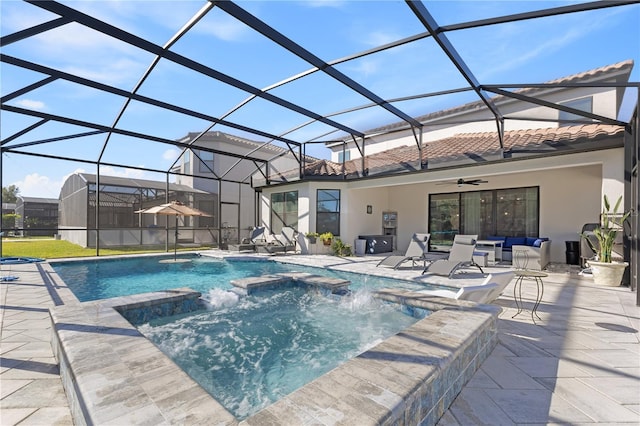 view of pool featuring pool water feature, a patio, ceiling fan, and a lanai