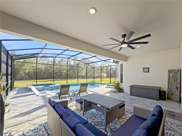 view of patio with a lanai, an outdoor living space, and ceiling fan