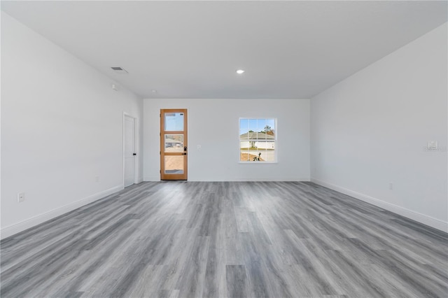 unfurnished room with light hardwood / wood-style flooring