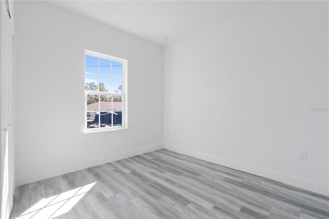 spare room featuring light hardwood / wood-style floors