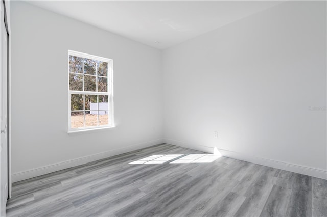 spare room featuring light hardwood / wood-style flooring