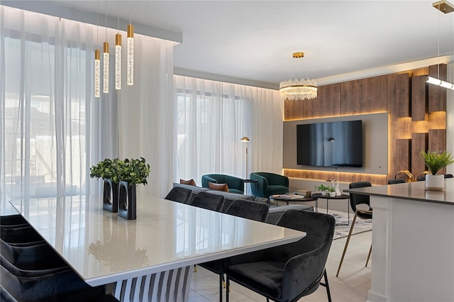 dining space with light tile patterned floors and an inviting chandelier