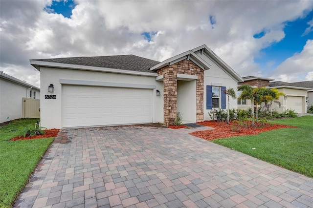 ranch-style home featuring a front yard and a garage