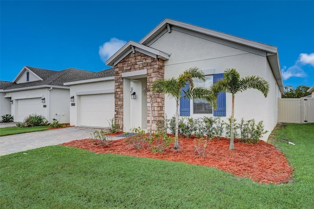 view of front of home featuring a front yard and a garage