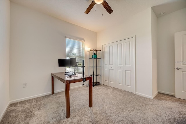 home office with ceiling fan and light colored carpet