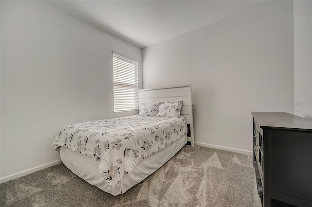 bedroom featuring light carpet