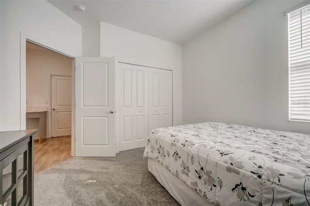 carpeted bedroom with a closet