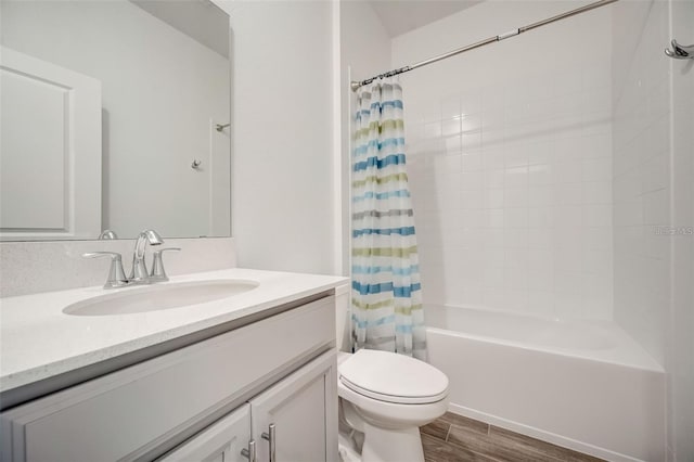 full bathroom featuring shower / bath combo, vanity, and toilet