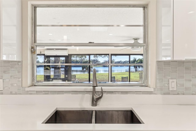 details with a water view and sink