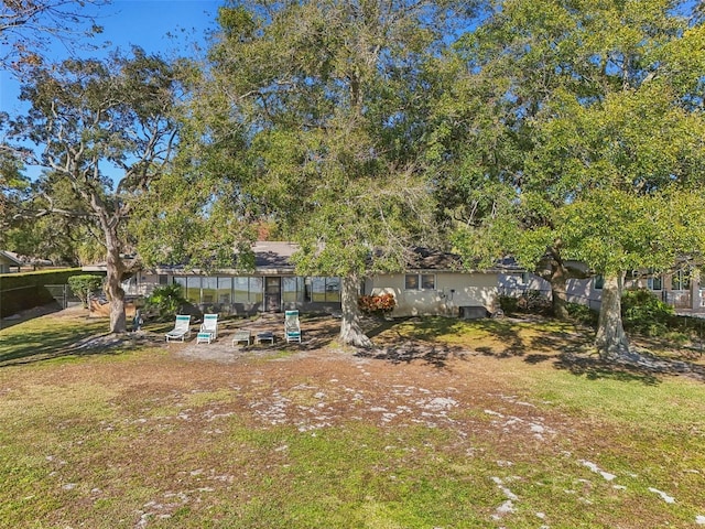 view of yard featuring a sunroom