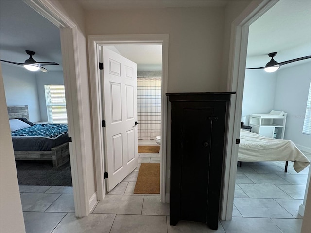 corridor with light tile patterned floors