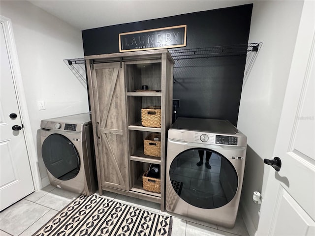 laundry area with light tile patterned flooring