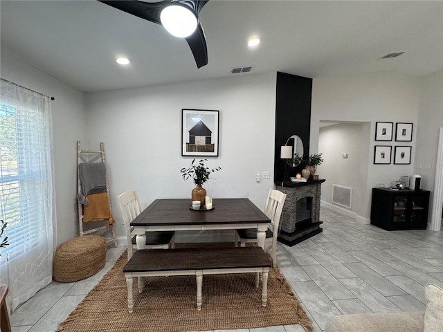 tiled dining area with vaulted ceiling