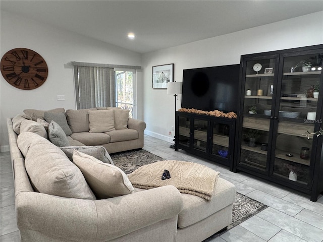 tiled living room with lofted ceiling