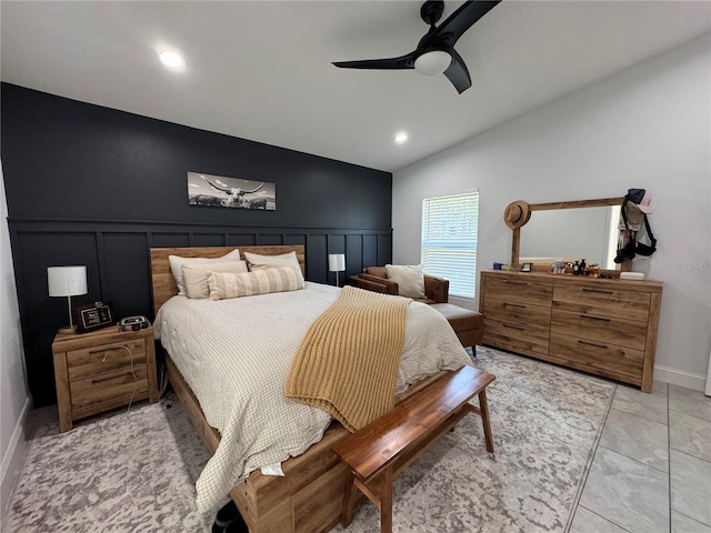 bedroom with ceiling fan, light tile patterned floors, and lofted ceiling