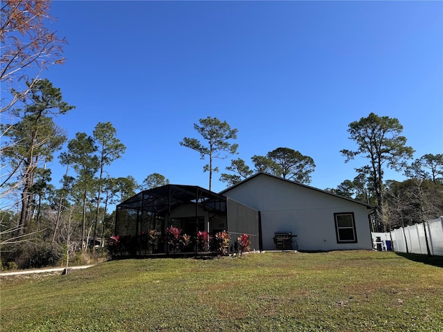 view of yard featuring glass enclosure