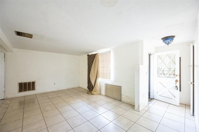 interior space with light tile patterned floors