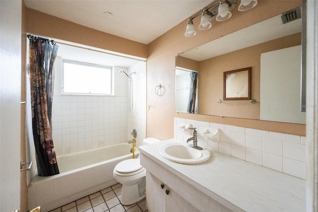 full bathroom featuring shower / bath combo, tasteful backsplash, tile patterned floors, toilet, and vanity