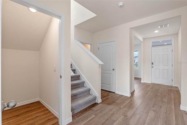 foyer with light hardwood / wood-style floors