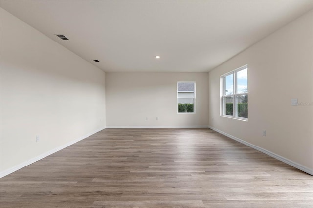 unfurnished room featuring light wood-type flooring