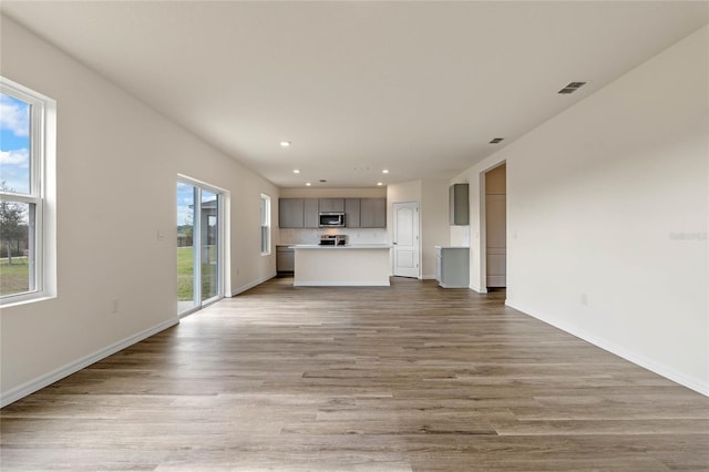 unfurnished living room featuring light hardwood / wood-style floors