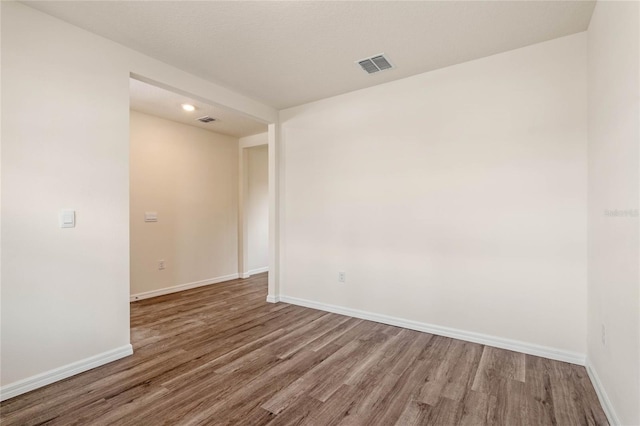 empty room with wood-type flooring