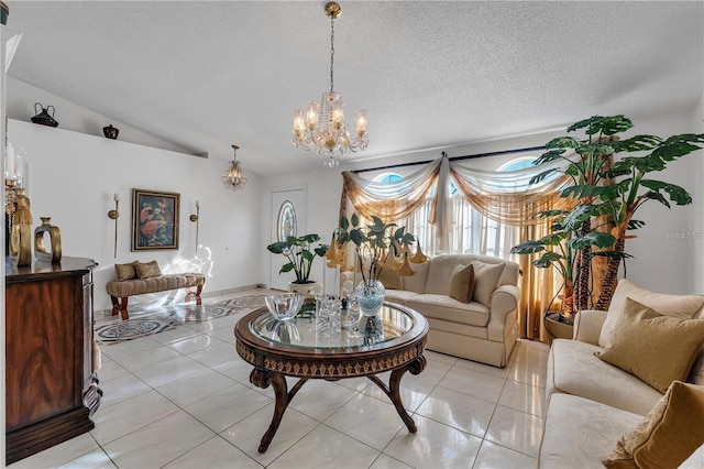 tiled living room featuring a notable chandelier, lofted ceiling, and a textured ceiling