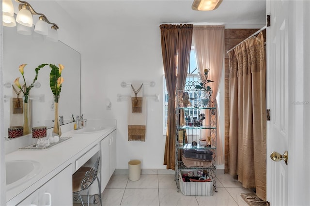 bathroom featuring tile patterned flooring and vanity