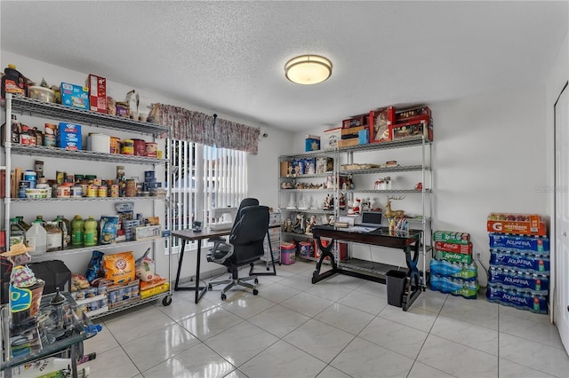 office space with light tile patterned flooring and a textured ceiling