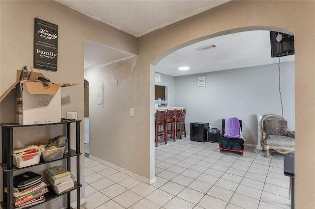 interior space featuring light tile patterned floors