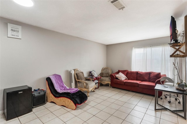 living room with light tile patterned floors