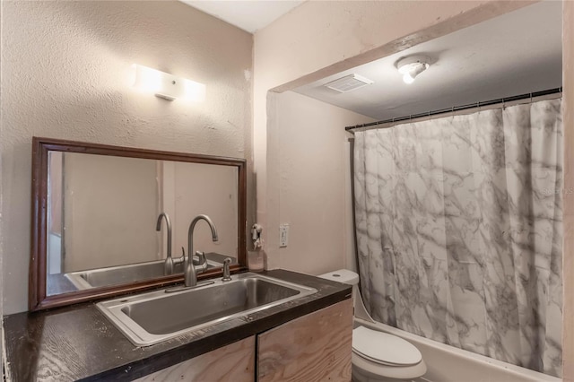 full bathroom with toilet, vanity, and shower / bath combination with curtain