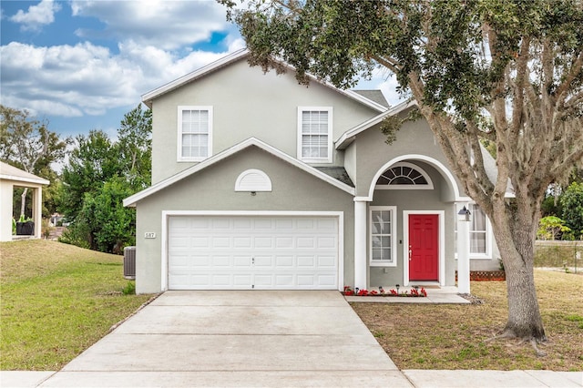 front of property with a front yard, central AC, and a garage