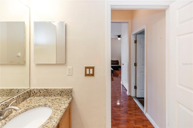 bathroom featuring vanity and ceiling fan