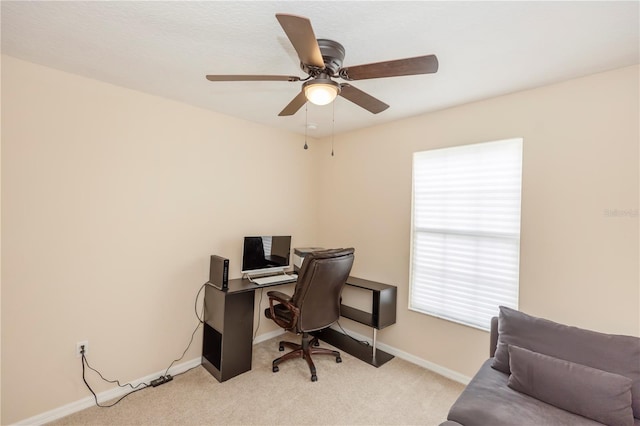 carpeted office with ceiling fan