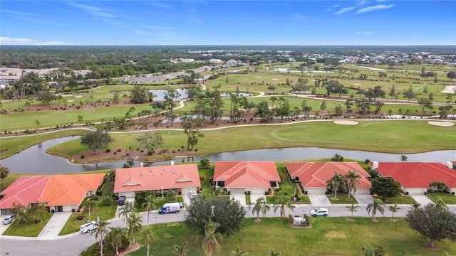 aerial view featuring view of golf course, a water view, and a residential view