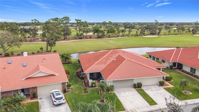 aerial view featuring a water view and view of golf course