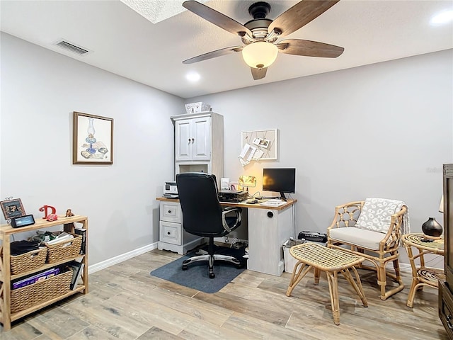 office area with visible vents, baseboards, a ceiling fan, light wood-style flooring, and recessed lighting