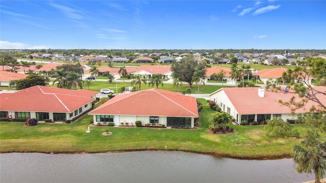 bird's eye view featuring a water view and a residential view