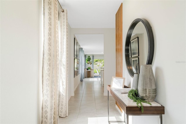 hall featuring light tile patterned flooring