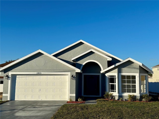 single story home featuring a garage