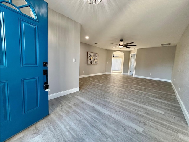 foyer with ceiling fan and hardwood / wood-style floors