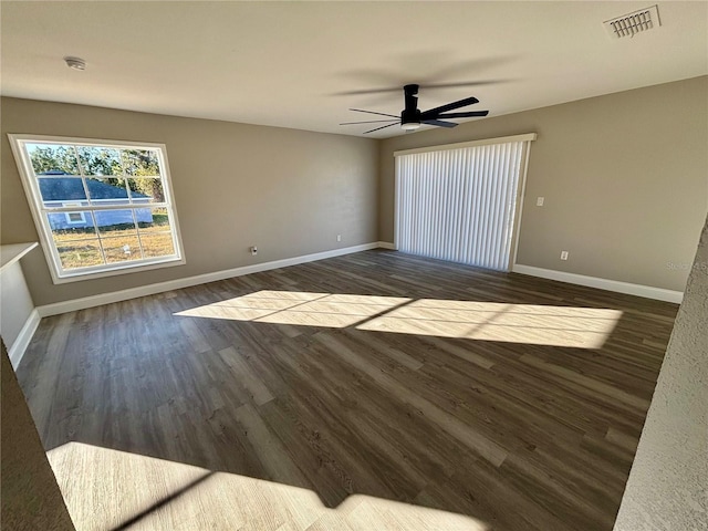 empty room featuring dark hardwood / wood-style floors and ceiling fan