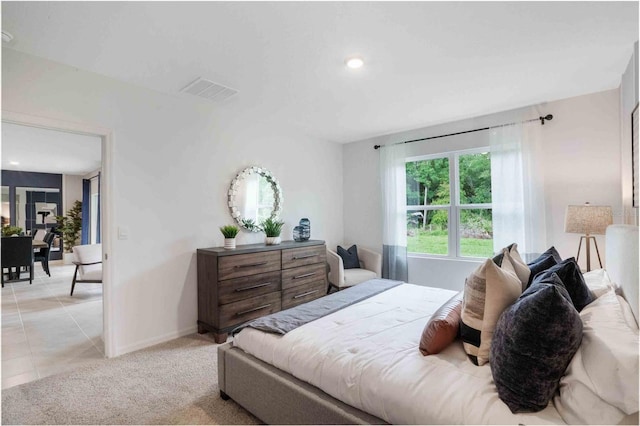 bedroom featuring light tile patterned flooring