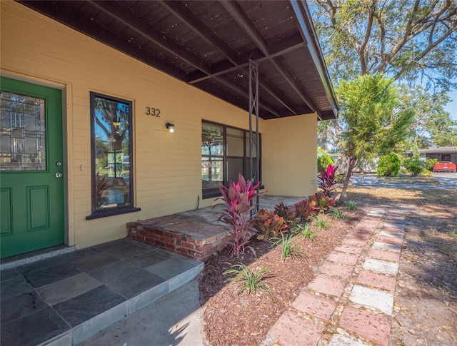 doorway to property featuring a patio