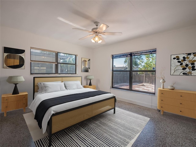 bedroom with ceiling fan and multiple windows